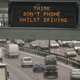 A photo of a sign saying "don't phone whilst driving".